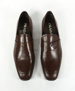 PRADA - Asymmetrical Leather Logo Penny Loafers Brown - 9