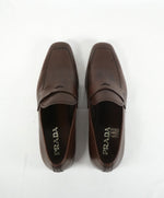 PRADA - Asymmetrical Leather Logo Penny Loafers Brown - 9